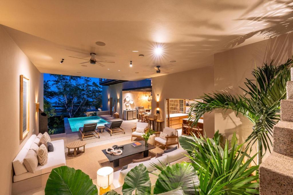a living room with a lot of plants at 3086 - TreeTop Villa in Tangolunda