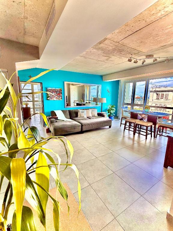 a living room with a couch and a table at Spacious Loft-Sea view Atlantis by Stay Here PR in San Juan