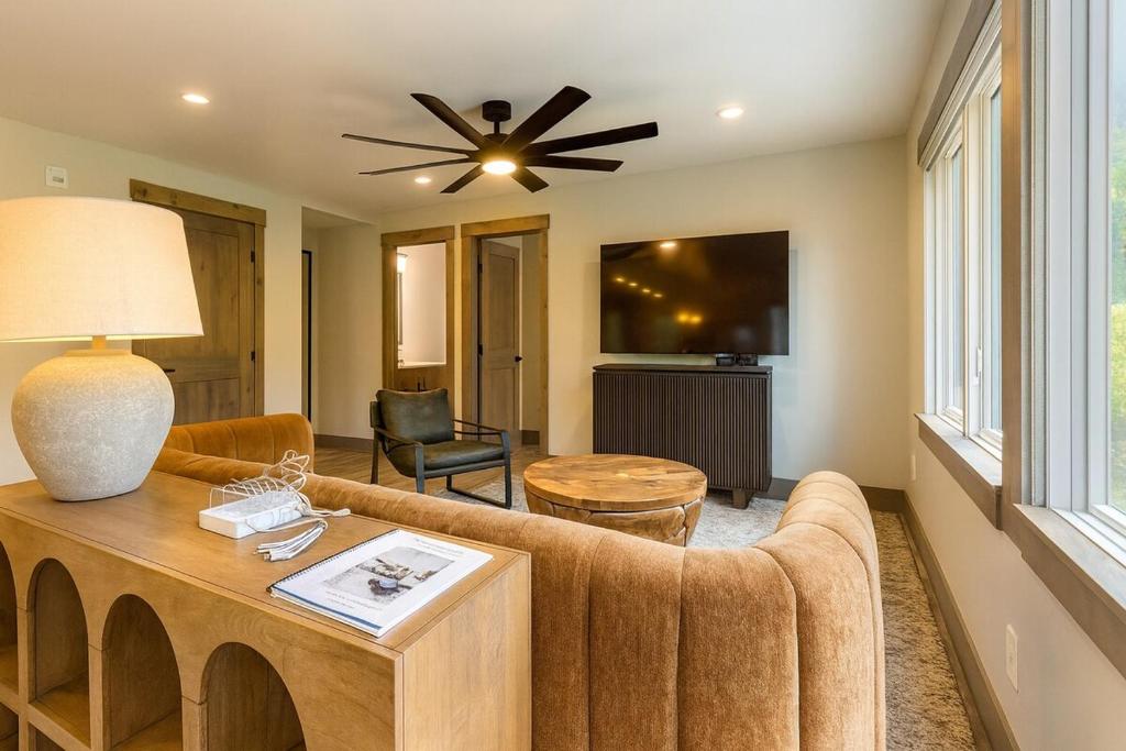 a living room with a couch and a table at NEW 2BR w/ Ski Views, Bunk Room & Resort Access in Durango Mountain Resort