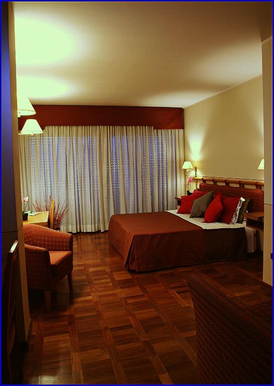 Postel nebo postele na pokoji v ubytování Hotel Meeting