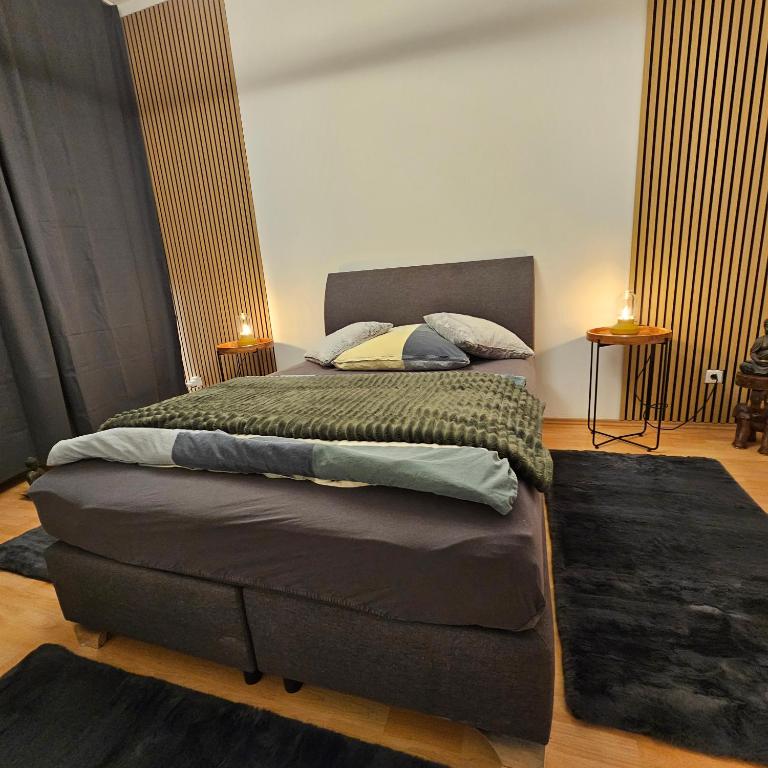 a bedroom with a large bed with two lamps on it at Sweet Apartment Düsseldorf City B27 in Düsseldorf