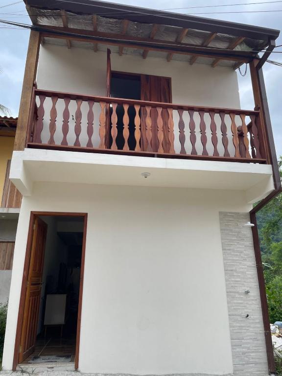 a view of the outside of a house with a balcony at Paraty Prime House in Paraty