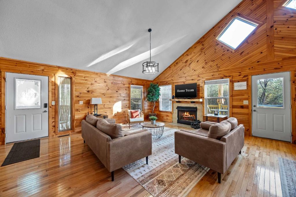 a living room with two couches and a fireplace at Mountain Cabin Fireplace Views Fire Pit in Sautee Nacoochee
