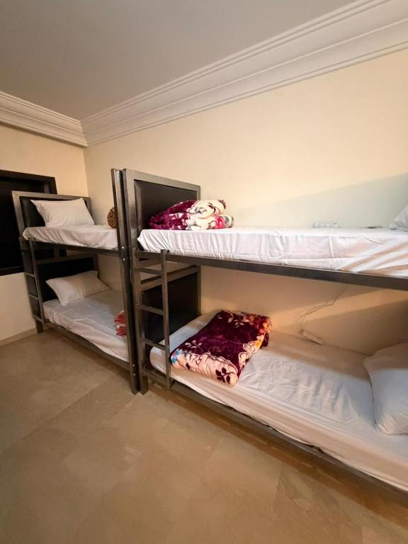 a room with two bunk beds in a room at Aya House in Casablanca
