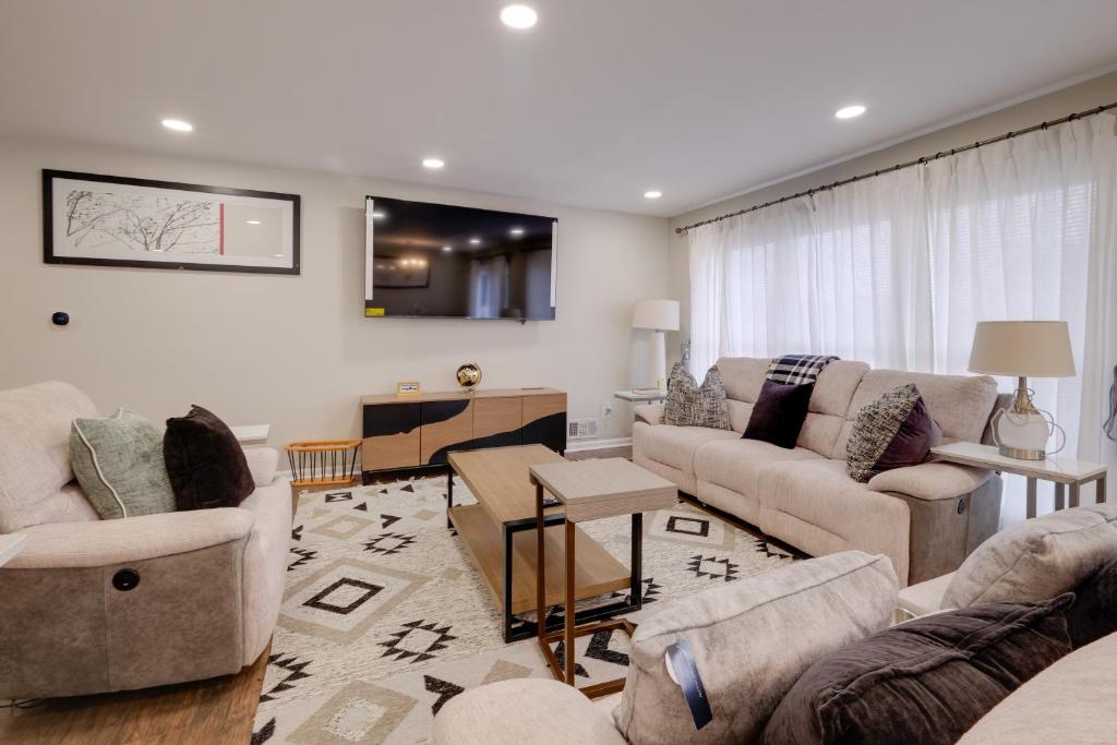 a living room with two couches and a table at Great for Gatherings! Modern Lanham Duplex in Lanham