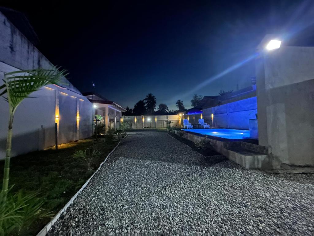 a night time view of a building with a street at Casa B Pasco in Dauin