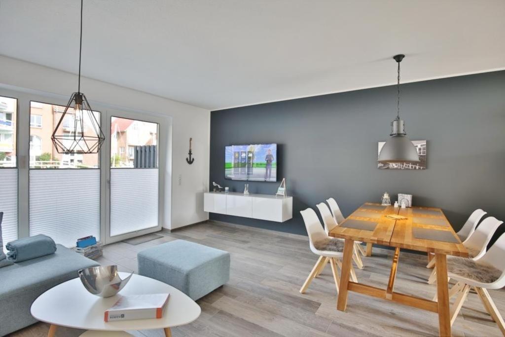 a living room with a table and a couch at City Marina, CM20b in Cuxhaven