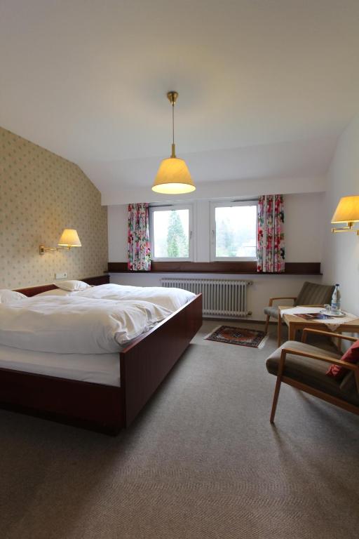 Postel nebo postele na pokoji v ubytování Hotel Gasthaus Tröster