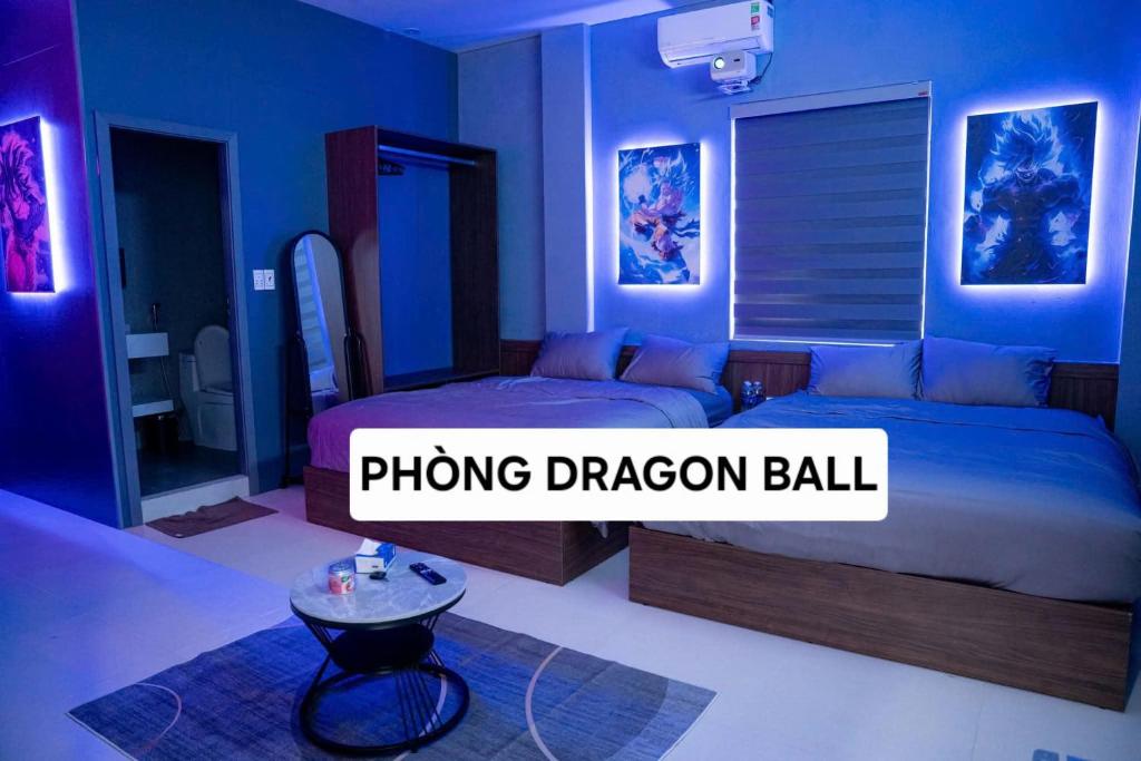 a bedroom with a bed and a table in it at 1993 Homestay G&C Quảng Trị in Quang Tri