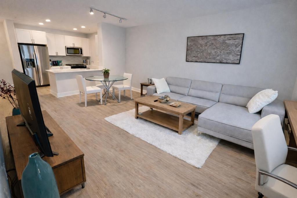 a living room with a couch and a table at Luxury 2 Bedrooms 2 Bathrooms With Pool and Gym in Los Angeles