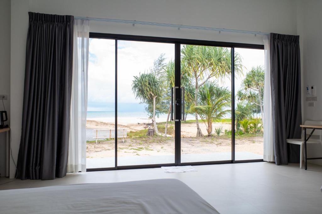 Postel nebo postele na pokoji v ubytování The Rock Coco Villa 2