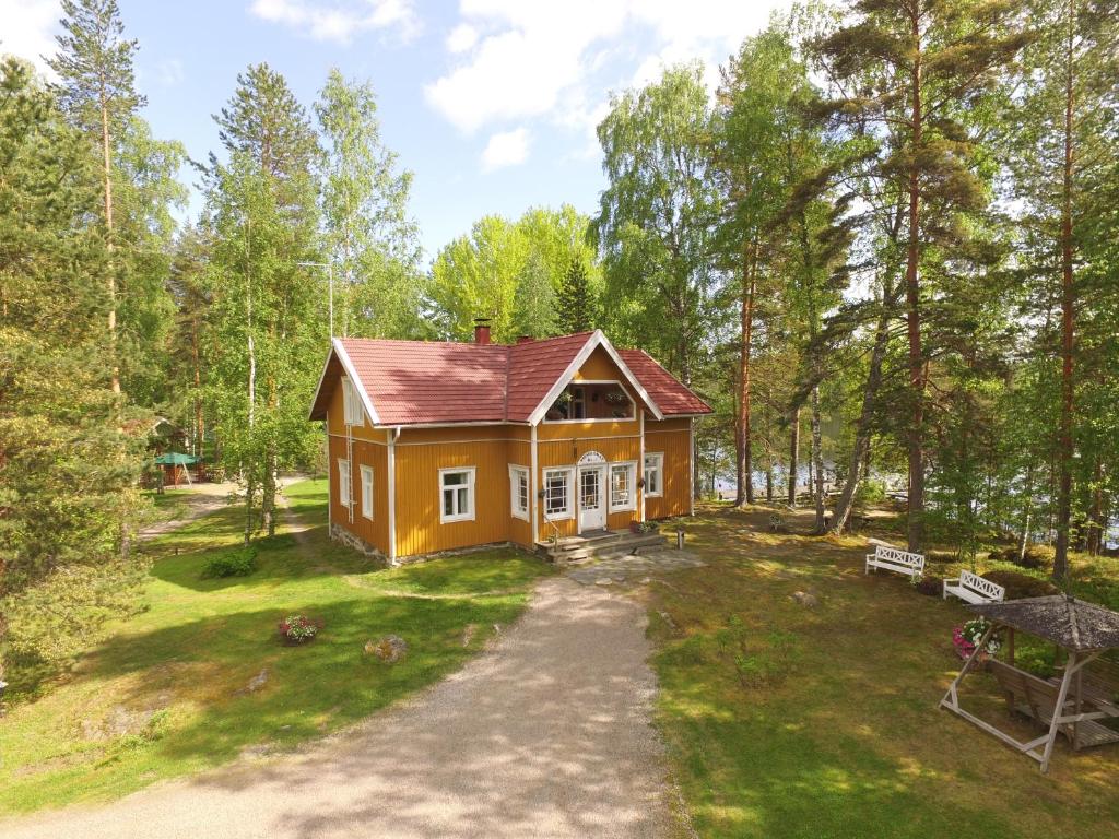 an aerial view of a small house in the woods at Niemilomat in Varkaus