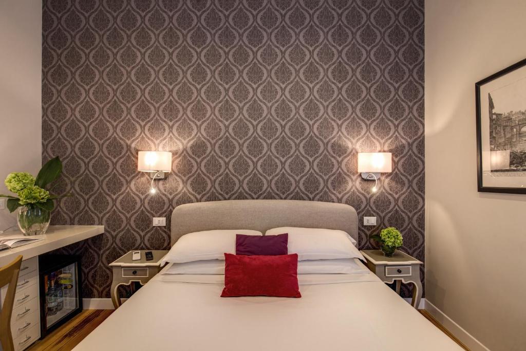 Letto o letti in una camera di The Club Navona