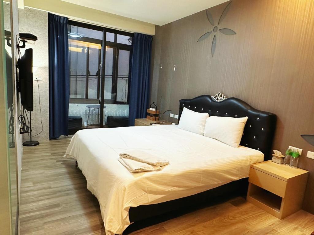 En eller flere senge i et værelse på 辰沐溫泉民宿