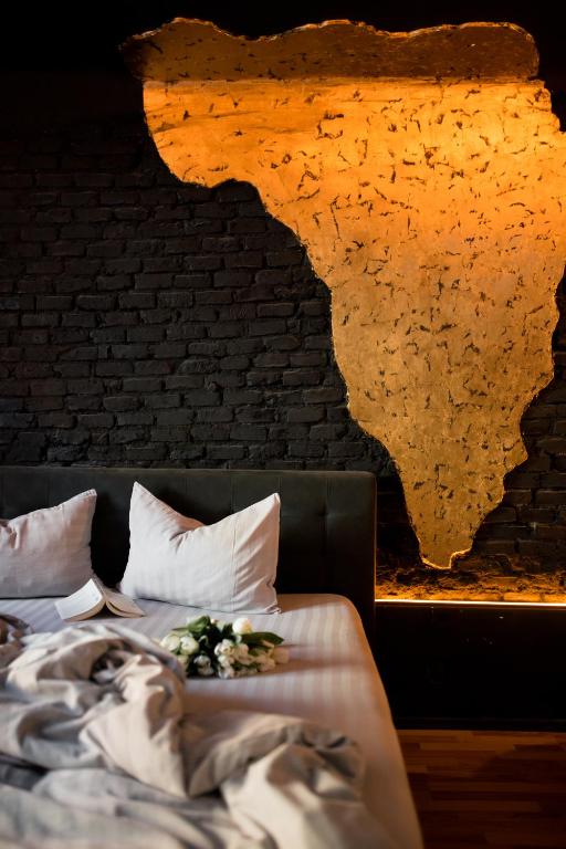 Postel nebo postele na pokoji v ubytování World Studio Opera Sibiu