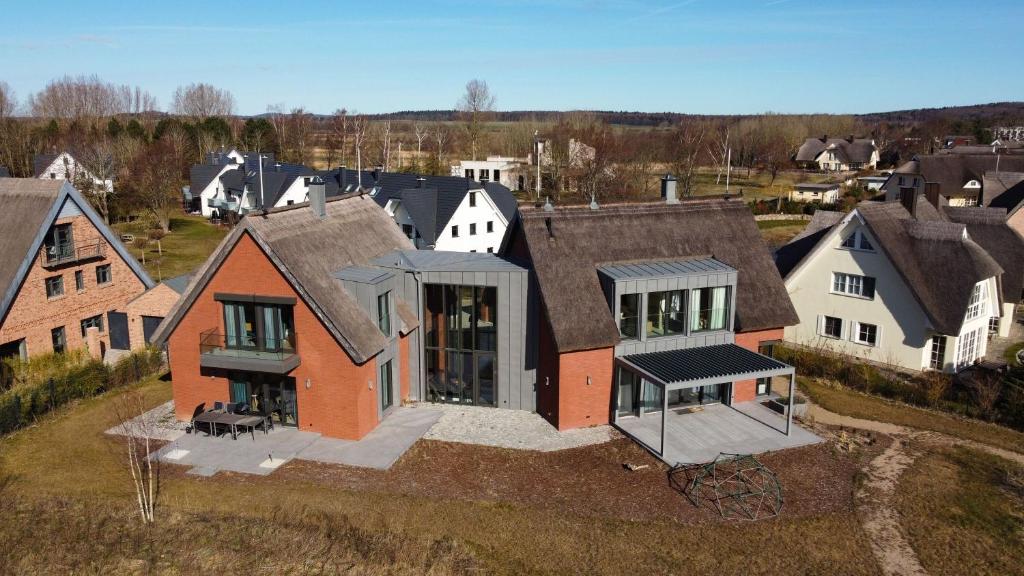 an aerial view of a house in a village at Ferienhaus Baltic in Lobbe in Lobbe
