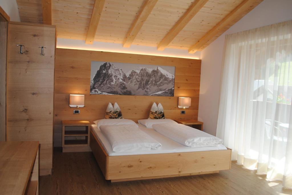 Postel nebo postele na pokoji v ubytování Hotel Garni Walter