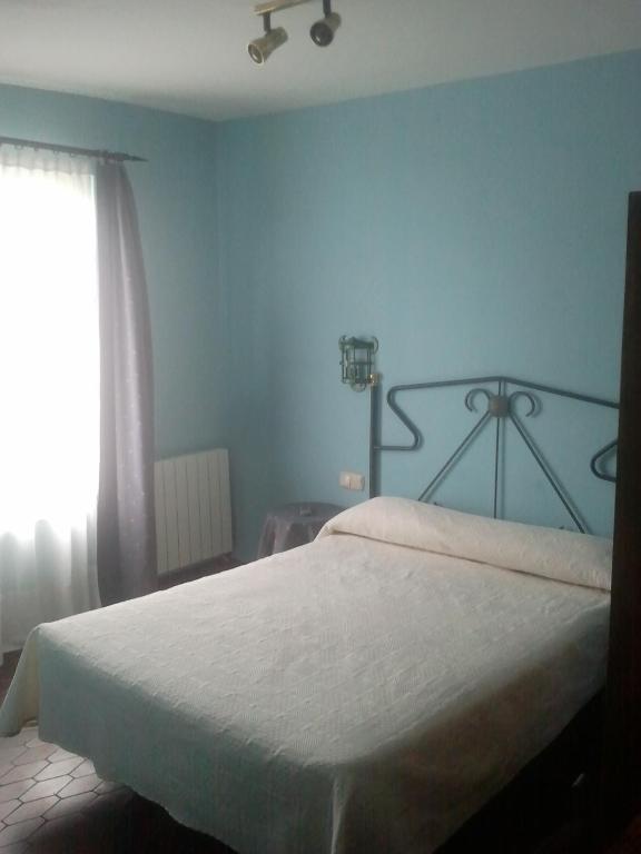 Postel nebo postele na pokoji v ubytování Hotel Los Laureles