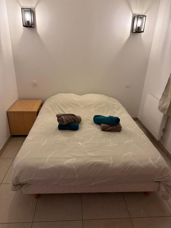Postel nebo postele na pokoji v ubytování Appartement Verneuil
