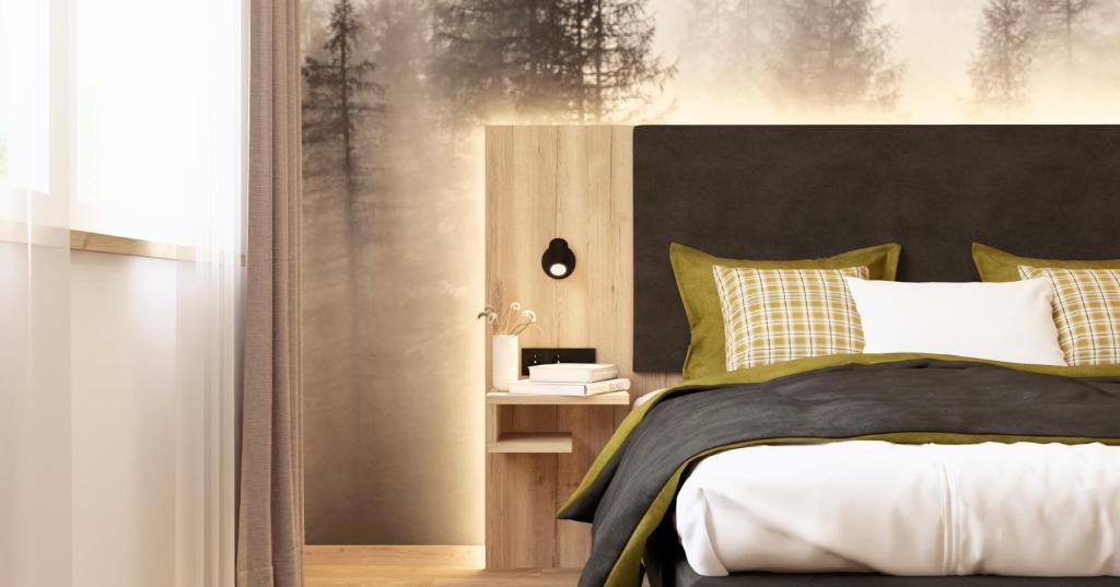 En eller flere senge i et værelse på Wohlfühlhotel zur Grässelmühle