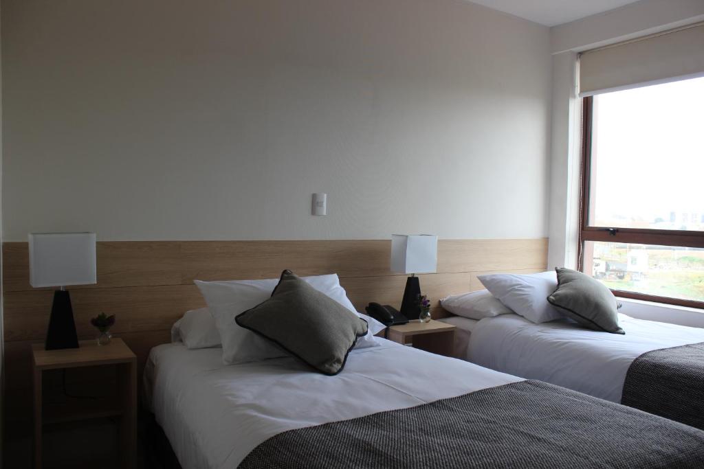 Postel nebo postele na pokoji v ubytování Hotel Umawue
