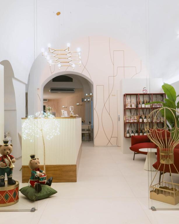 a store with two teddy bears on display in a room at Dama Bianca Boutique Hotel Ostuni in Ostuni