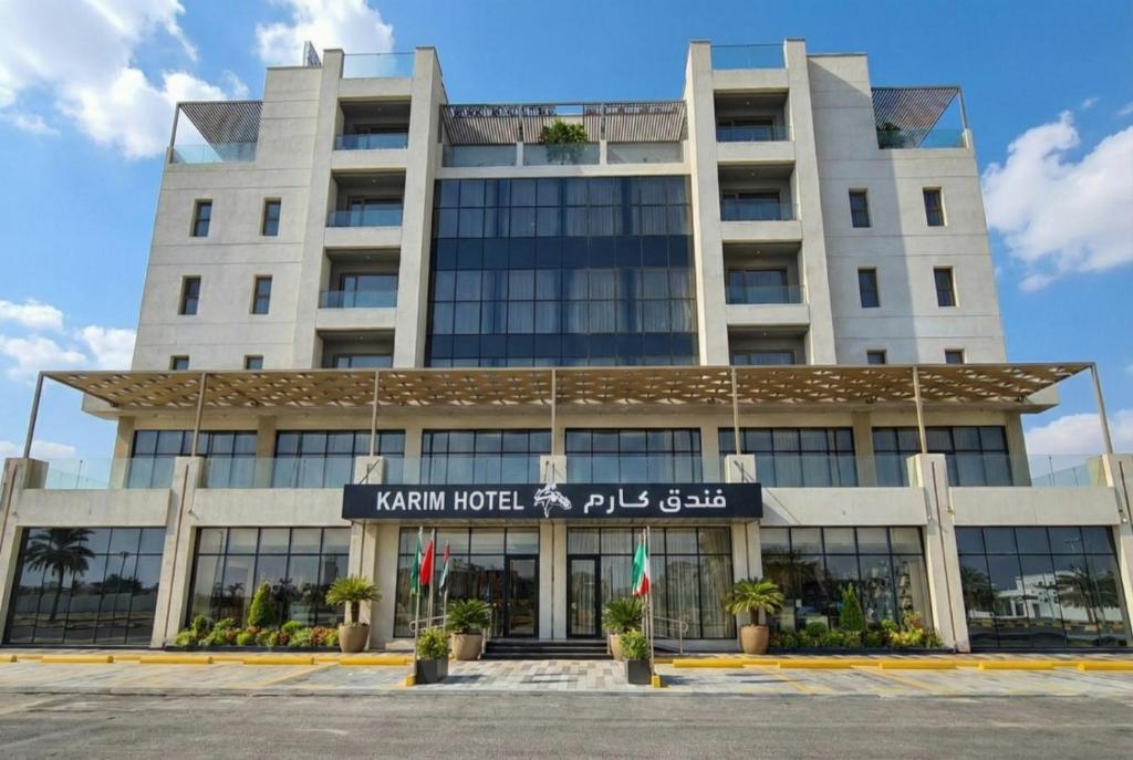 a hotel in front of a building at Karim Hotel in Dammam