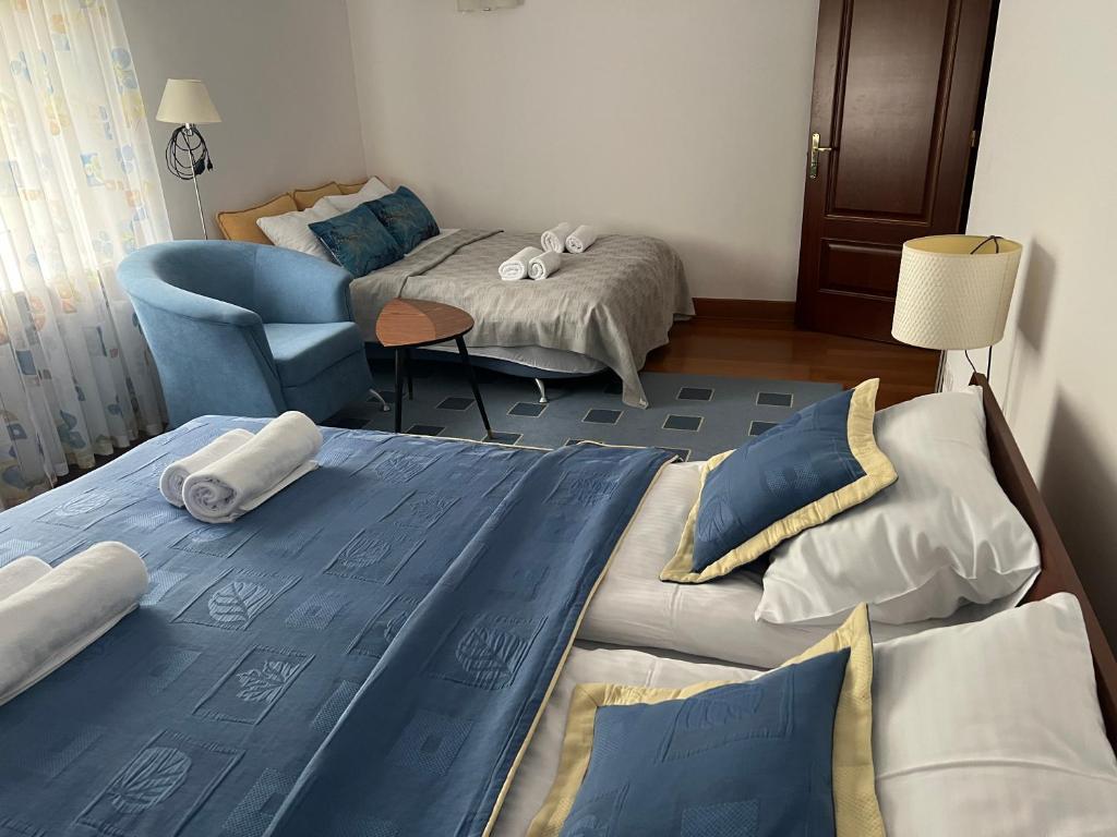 Postel nebo postele na pokoji v ubytování Słoneczny Zakątek Krynica-Zdrój