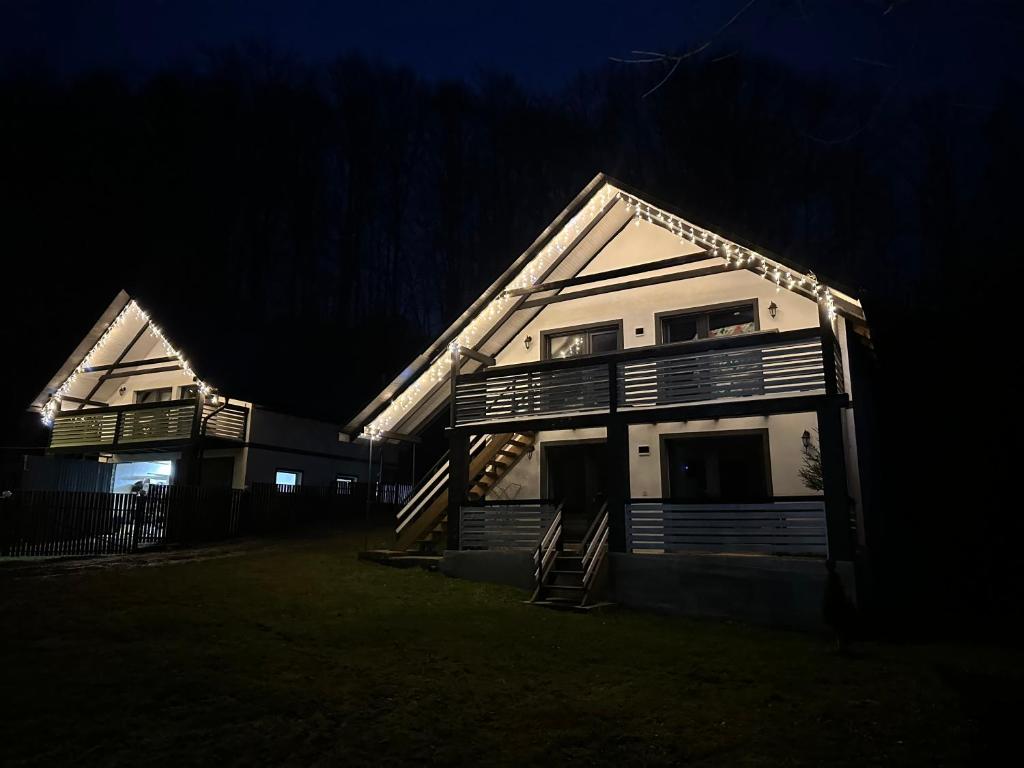 a house at night with its lights on at Family House in Izki