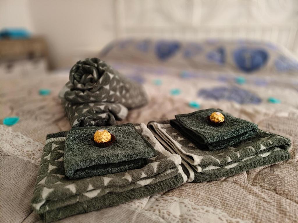 two towels sitting on top of a bed at Romantico Rifugio in Guardiagrele