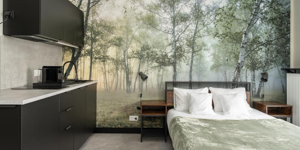 En eller flere senge i et værelse på Praga Studio Apartments