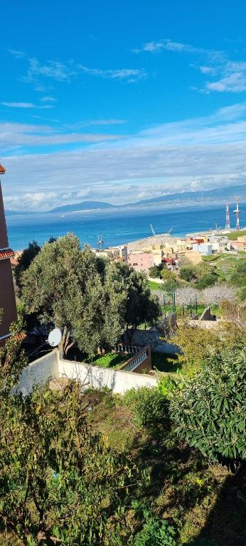 a view of a beach with the ocean in the background at Horizon heights in El Haouma