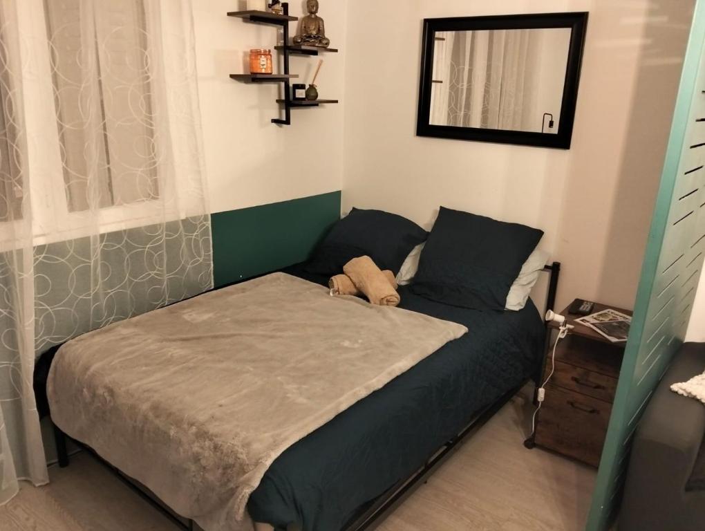 En eller flere senge i et værelse på Simplicité, efficacité, convivialité !