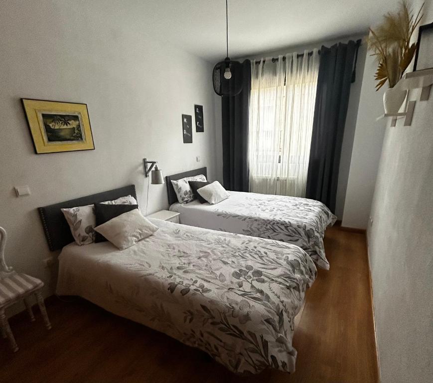 En eller flere senge i et værelse på El Rincón del Pisuerga con Terraza