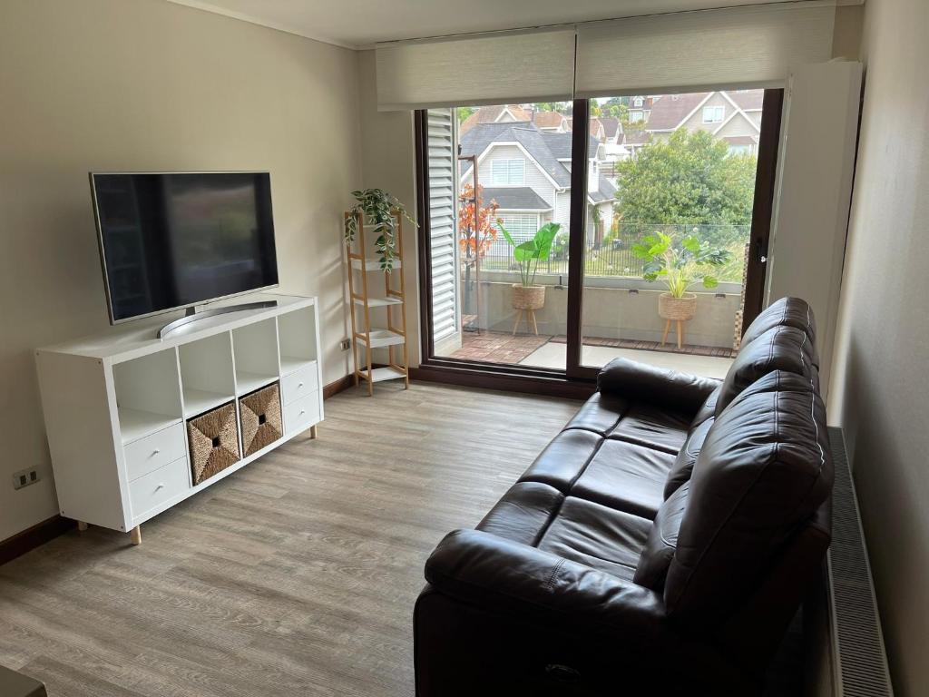 Et tv og/eller underholdning på Puerto Varas Apartment - Cerro Philippi