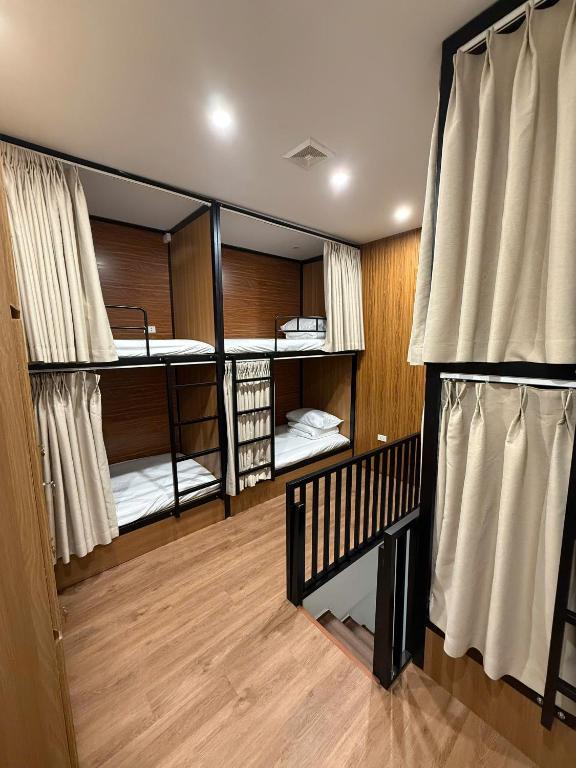 a room with four bunk beds in it at Peanut Stay Hostel in Hanoi
