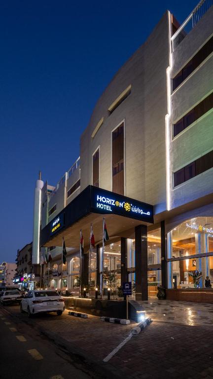 a hotel building with a car parked in front of it at فندق هورايزون-Horizon Hotel in Najran