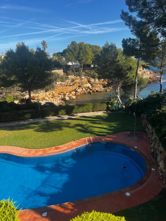 a swimming pool in the yard of a house at Cala Llobeta in Calafat