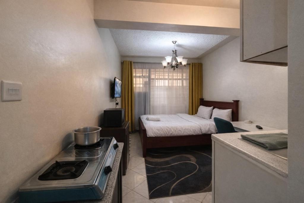 En eller flere senge i et værelse på Rest and Go Studio