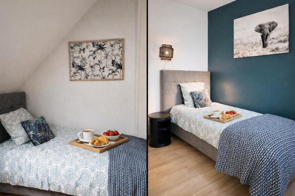 een slaapkamer met twee bedden en een dienblad met eten op een dienblad bij Enjoy en Champagne maison calme au milieu du vignoble avec parking gratuit in Dormans