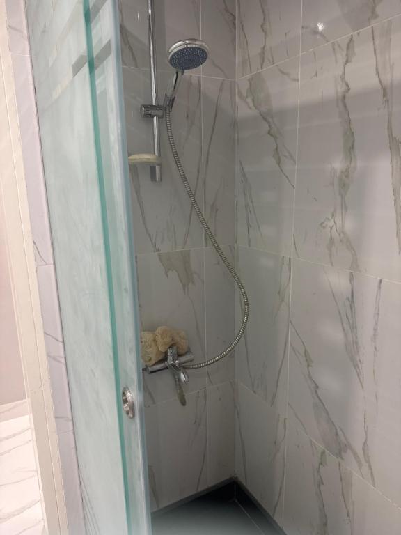 a shower with a shower head in a bathroom at Veranda resort in Hurghada