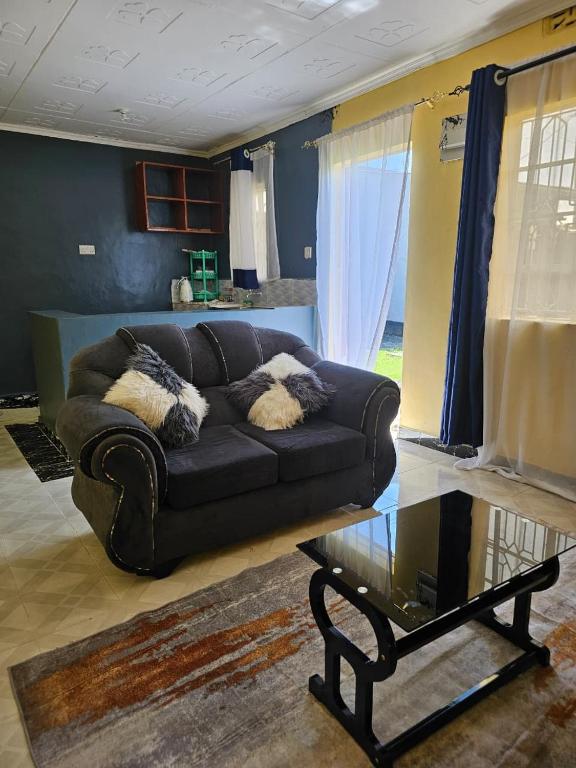 a living room with a couch and a coffee table at ZuriStay in Nakuru