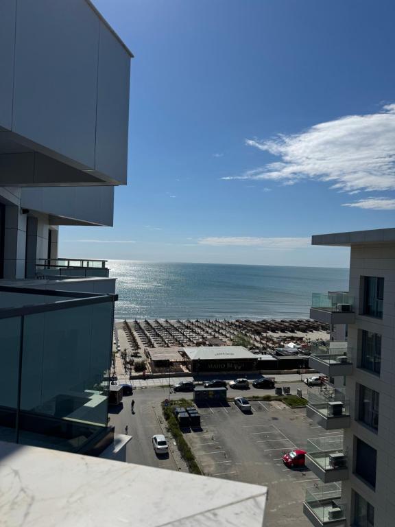 a view of a parking lot and the ocean at Alezzi Infiniti Resort & SPA - SUNRISE 349 in Năvodari