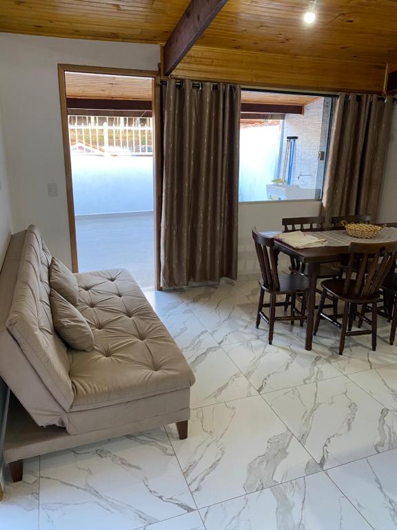 Posezení v ubytování Kitnet Centro da Cidade