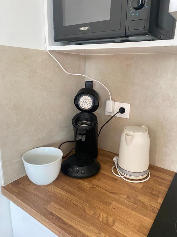 Nhà bếp/bếp nhỏ tại Appart Cosy près de la Gare & Centre ville