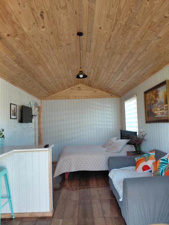 Giường trong phòng chung tại Tiny House Aeropuerto el Tepual