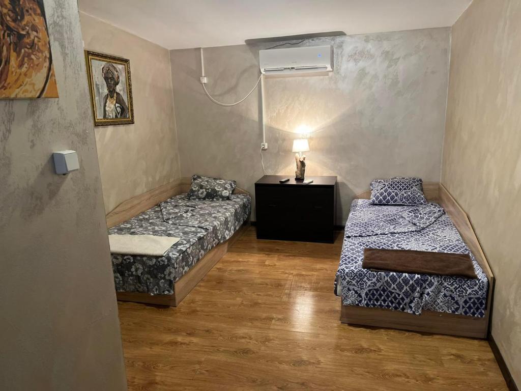 En eller flere senge i et værelse på Стая за нощувки Престиж 3