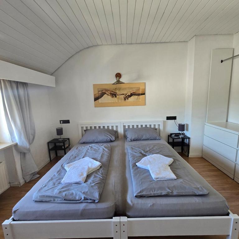 a bedroom with two beds in a room at Room 3 - shared house in Linz am Rhein