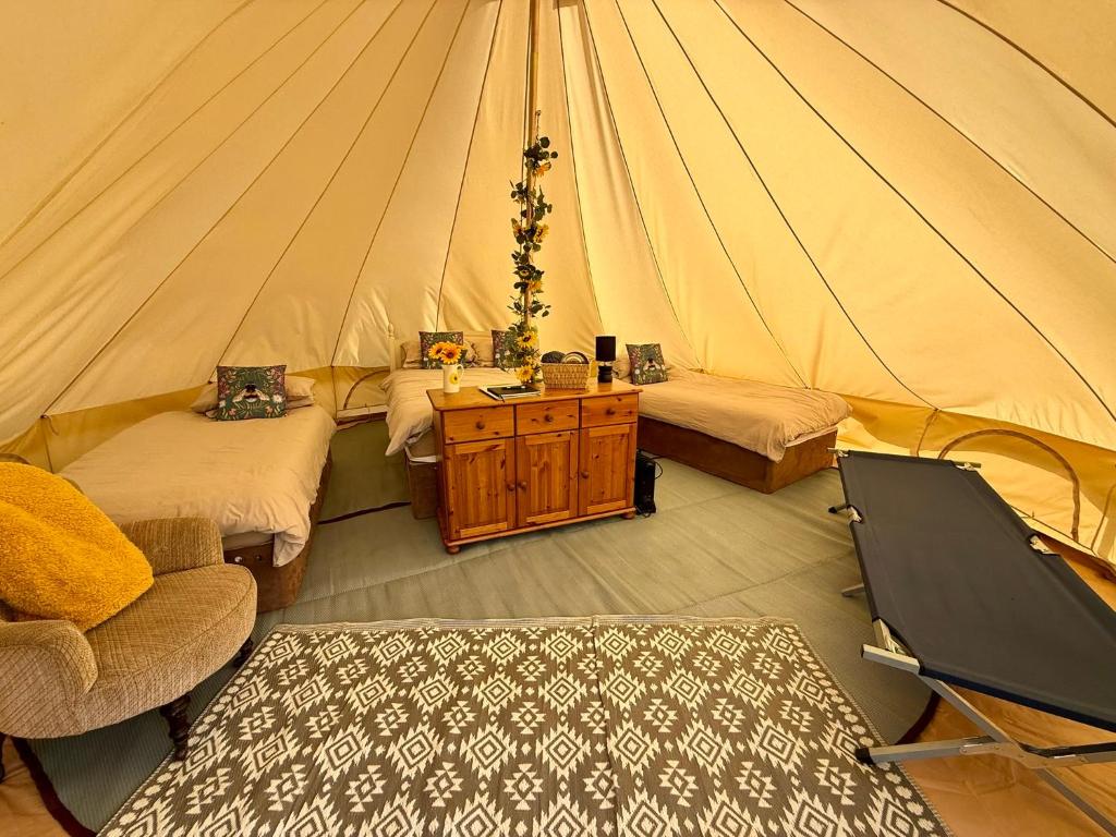 a room with two beds in a tent at The Beehive in Narberth
