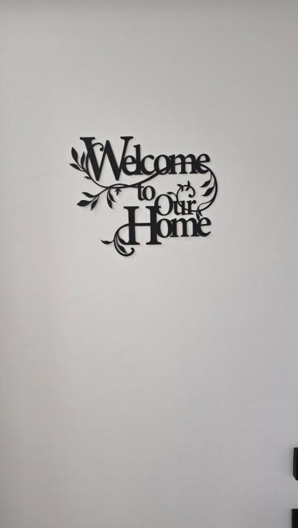 a sign that says welcome to our home at Elian's Nest in Saskatoon